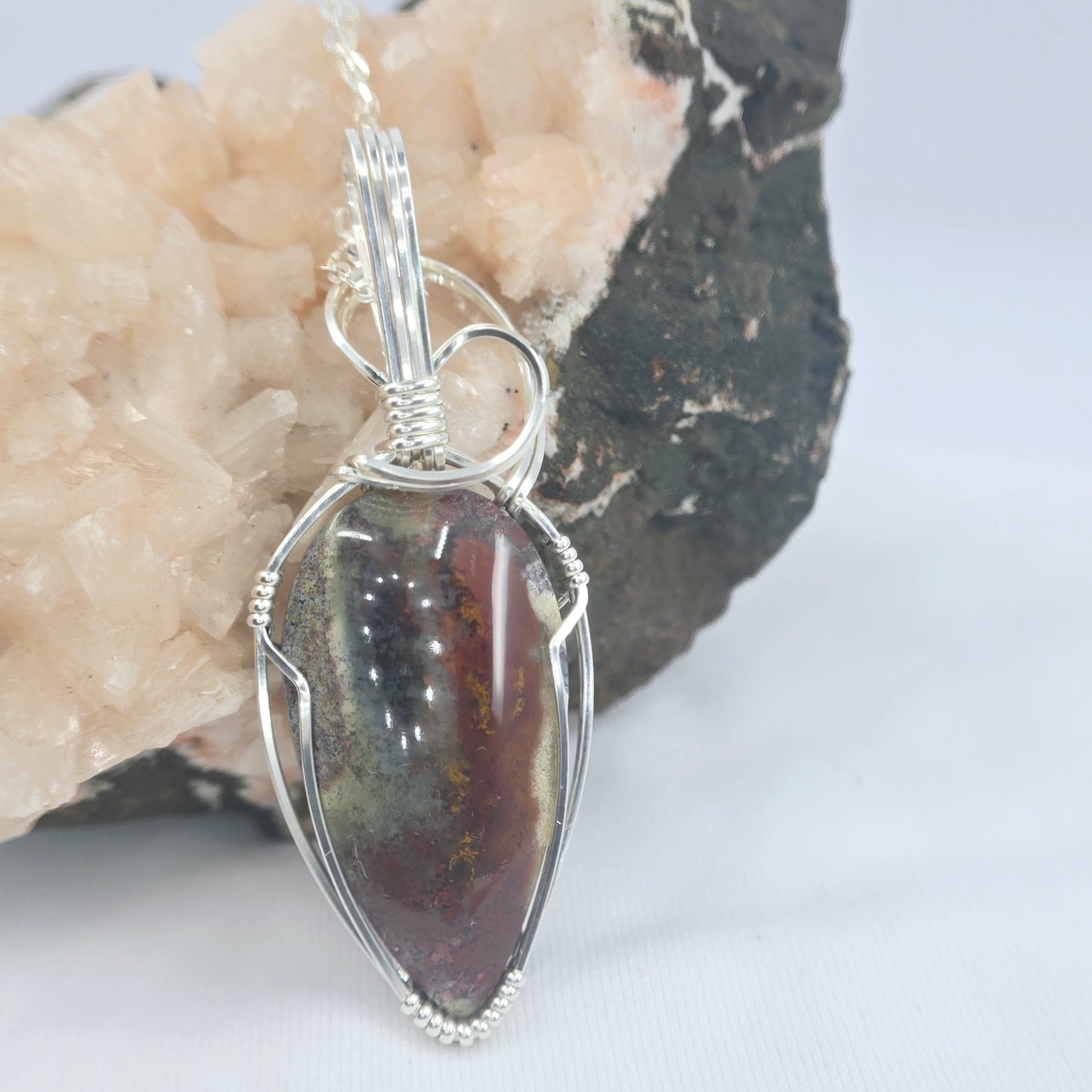 Dragon's Blood Pendant Wrapped In Sterling Silver