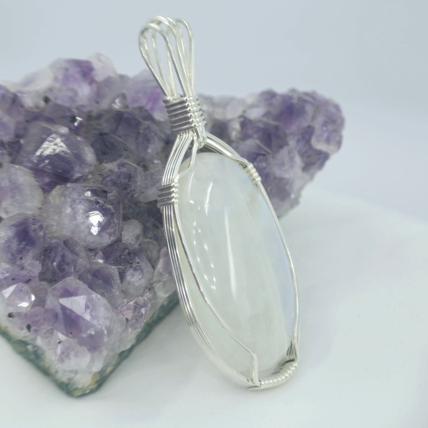 White Moonstone Pendant Wrapped In Sterling Silver