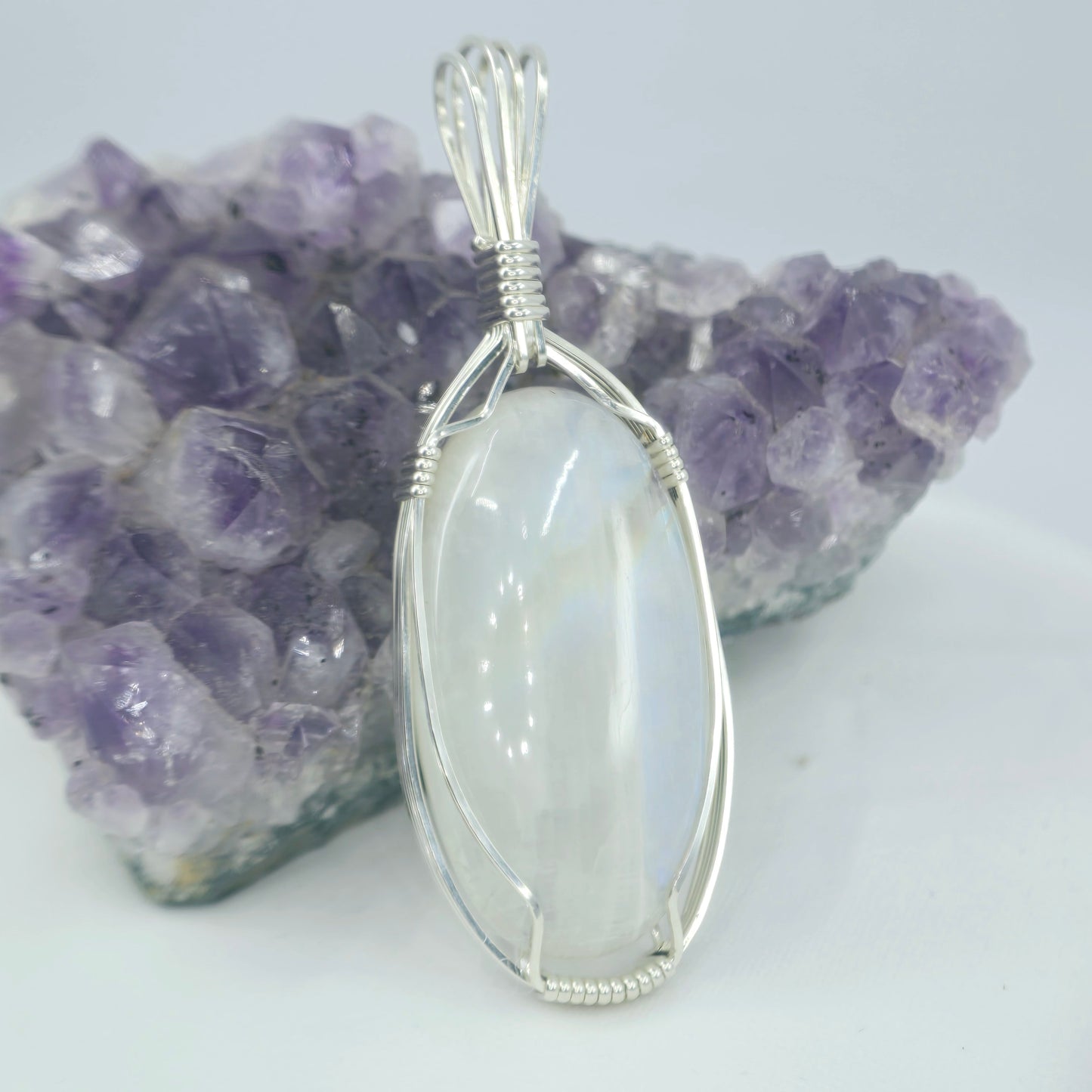 White Moonstone Pendant Wrapped In Sterling Silver