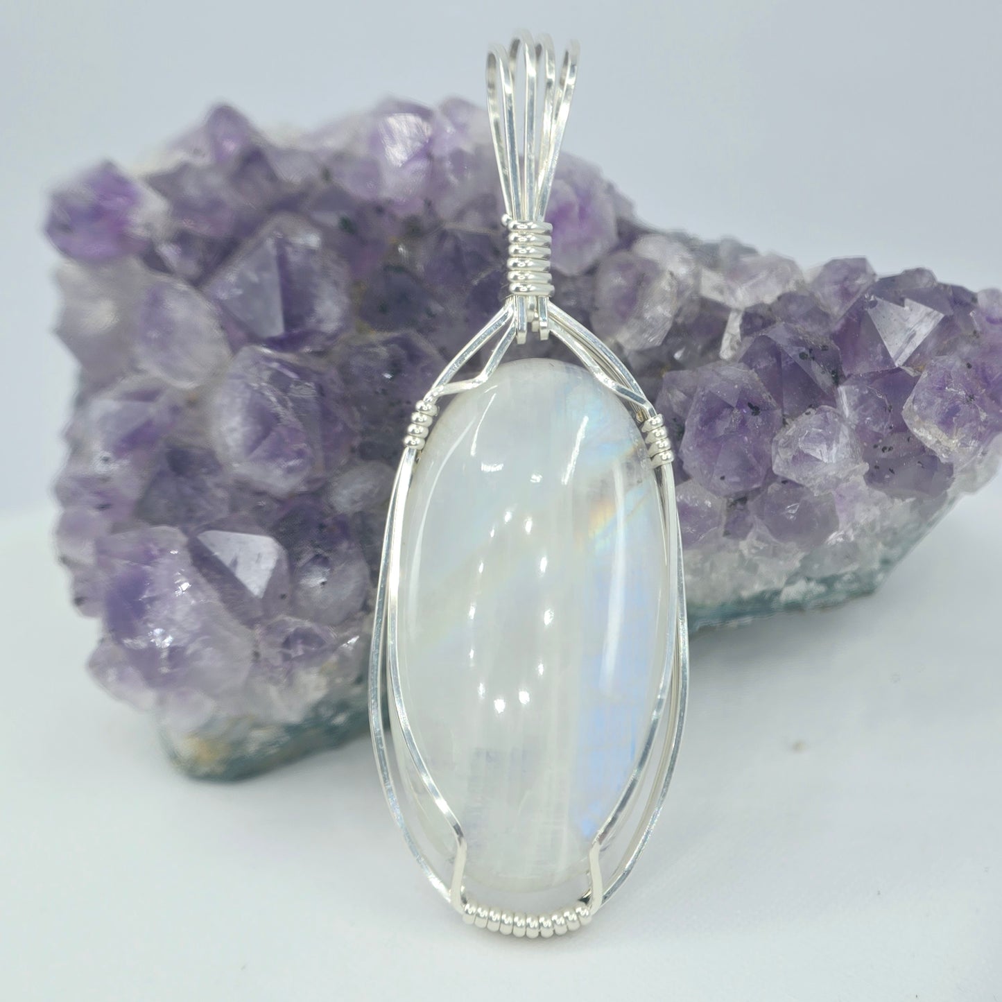 White Moonstone Pendant Wrapped In Sterling Silver