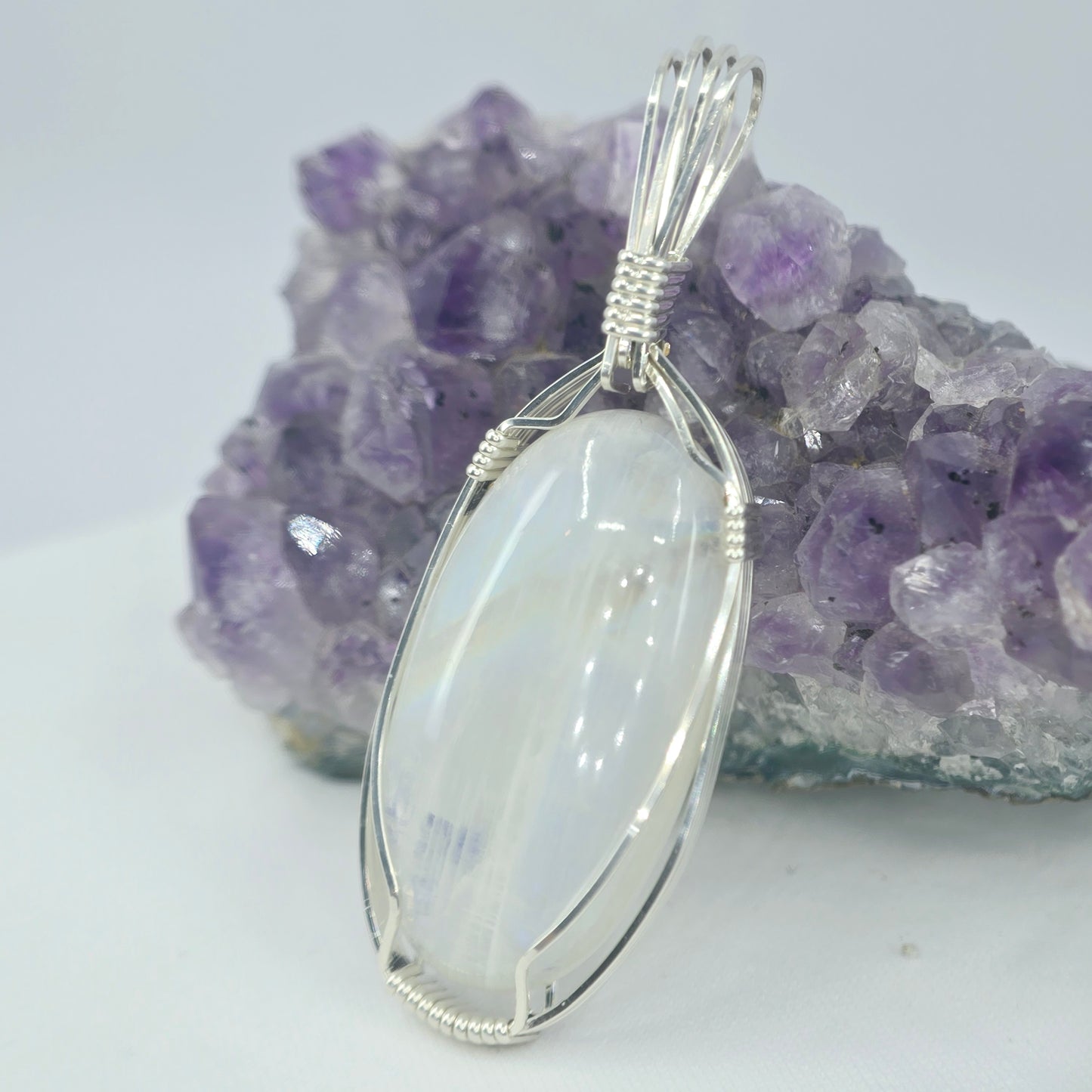 White Moonstone Pendant Wrapped In Sterling Silver